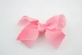 Pink gradient grosgrain ribbon hair bow accessory with a symmetrical handmade design - Watermelon red