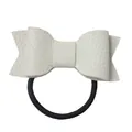 Close-up of off-white faux leather hair tie with lychee texture and black elastic band - Beige