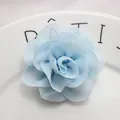 Macro shot of light blue chiffon flower with multi-layer petals and pearl center detail - Light Blue