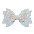 Detailed close-up of glitter hair clip featuring white wings and light blue sequins - White