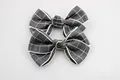 Set of two gray and white checkered bow hair clips for baby girls in a minimalist style - Black