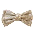 Close-up of glitter bow hair clip with colorful laser sequins on champagne gold fabric - Khaki