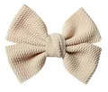 Detail of cream waffle texture fabric bow with a layered design for DIY hair accessories - Khaki