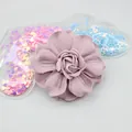 Detailed view of dusty rose handmade fabric flower with layered petals for DIY crafts - Purple Pink