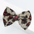 Detail of sequined bow accessory with leopard pattern for hair accessories and shoes - Red