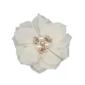 Detailed close-up of ivory chiffon flower with center pearl and rhinestone accents - Flat Pad / Beige
