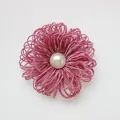 Pinkish purple metallic thread flower accessory with a large central white pearl - Dust Rose