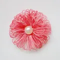Handmade pink fabric flower accessory with center pearl and woven rope petals - Light Watermelon Red