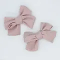 Pair of vintage Morandi pink cotton linen bow hair clips with textured fabric details - Dust Rose