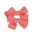 Close-up of pink linen fabric bow hair clips for girls with detailed woven texture - Watermelon red