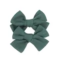 Detailed close-up of dark green fabric bow hair clips with refined woven texture - Dark Green