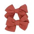Detail of two handmade brick red cotton linen bow hair clips for girls on white background - Antique Bronze