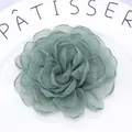 Macro detail of teal organza layered petals with intricate embroidered edge texture - Grey Green
