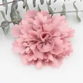 Detail of a dusty pink handmade fabric flower with multi-layered pleated chiffon petals - Pink