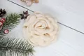Detailed close-up of a handmade cream fabric peony flower with multi-layered soft petals - Flat Pad / Beige