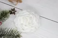 Detailed view of handcrafted white fabric camellia flower hair clip with layered petals - Flat Pad / White
