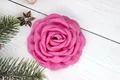 Detailed view of pink fabric rose handmade with textured petals on a rustic wood surface - Flat Pad / Rose Red Flat Bottom