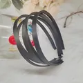 Set di 4 cerchietti neri minimalisti rivestiti in tessuto con texture antiscivolo - Nero
