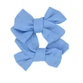 Pair of light blue cotton linen bow accessories with natural woven texture on white background - Blue