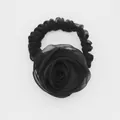Detail of elegant black organza rose hair scrunchie with soft fabric flower texture - Black