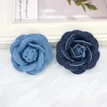 Close-up of handmade denim camellia flowers with frayed edges in light and dark blue denim - Camellia / Medium Large / Light Blue