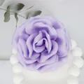 Macro shot of handcrafted 10cm purple satin fabric peony with detailed layered petals - Lavender