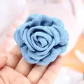 Close-up of blue denim fabric rose hair clip showing detailed textile texture and layers - Light Denim Blue