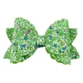 Detail of glitter bow straw accessory with green sequins and shiny fabric texture - Green