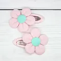 Pair of pink corduroy sunflower hair clips for girls with green button centers - Pink