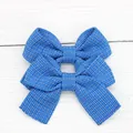 Pair of blue plaid fabric bow hair clips for girls with a textured woven pattern - Sapphire Blue