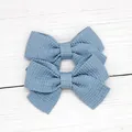 Set of two light blue textured woven bow hair clips for girls in minimalist style - Blue