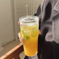 Vertical textured glass cup set with lid and straw holding fresh juice and ice - Paper Box Packaging / Medium / Clear