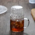 Vertical striped glass carafe set with handle and ice tea on dark wood desk - Cup And Lid / Stripe Style