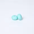 Two mint green abacus-shaped silicone beads for DIY jewelry and baby teethers - Caribbean Blue