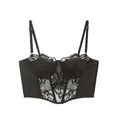 Makrodetail der schwarzen floralen Spitze und vertikalen Stäbe am Korsett-Bustier-Top - S / Schwarz