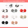 40 Stück 15mm Silikonperlen Set in 10 Farben inklusive Leoparden- und Pfotenmuster - Pfotenabdrücke und Leopardenmuster (Stil 2)