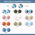 Set aus 40 gemischten Silikonperlen in 10 Stilen mit 15mm Durchmesser für DIY Schmuck - Puzzle- und Tarnmuster (Stil 4)