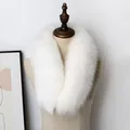 Detailed close-up of premium white fluffy faux fox fur scarf on a wooden mannequin stand - White Fox