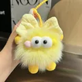 Dettaglio portachiavi in peluche giallo acceso con grandi occhi e cinturino con perline - Giallo