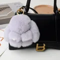 Simpatico portachiavi a forma di coniglio viola con anello d'oro su borsa in pelle - Grigio chiaro