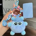 Detail of light blue fluffy monster keychain with knit hat and white sunglasses - Sky Blue