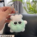 Close-up of fluffy green plush bear keychain with a white knit hat and sunglasses - Fresh Green