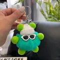Close-up of fluffy green plush ball keychain with white knit hat and small sunglasses - Fluorescent Green