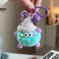 Cute mint green and purple faux rabbit fur plush keychain with a white knit hat - Lake Blue