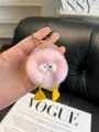 Pink fluffy monster plush keychain with yellow duck feet and gold metal ring - Light Purple