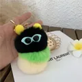 Close-up of a three-color plush caterpillar keychain with blue sunglasses and gold clip - Soot Sprite