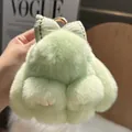 Close-up of mint green rabbit plush keychain with a soft bow and golden metal ring - Green