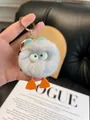 Gray rabbit fur plush duck keychain with large eyes and orange feet on a gold ring - Gray