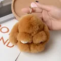 Brown fluffy faux fur bunny keychain with golden ring and white paws detail - Khaki