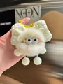 Plush ball keychain in beige with a white quilted bow and yellow metal ring - Off White